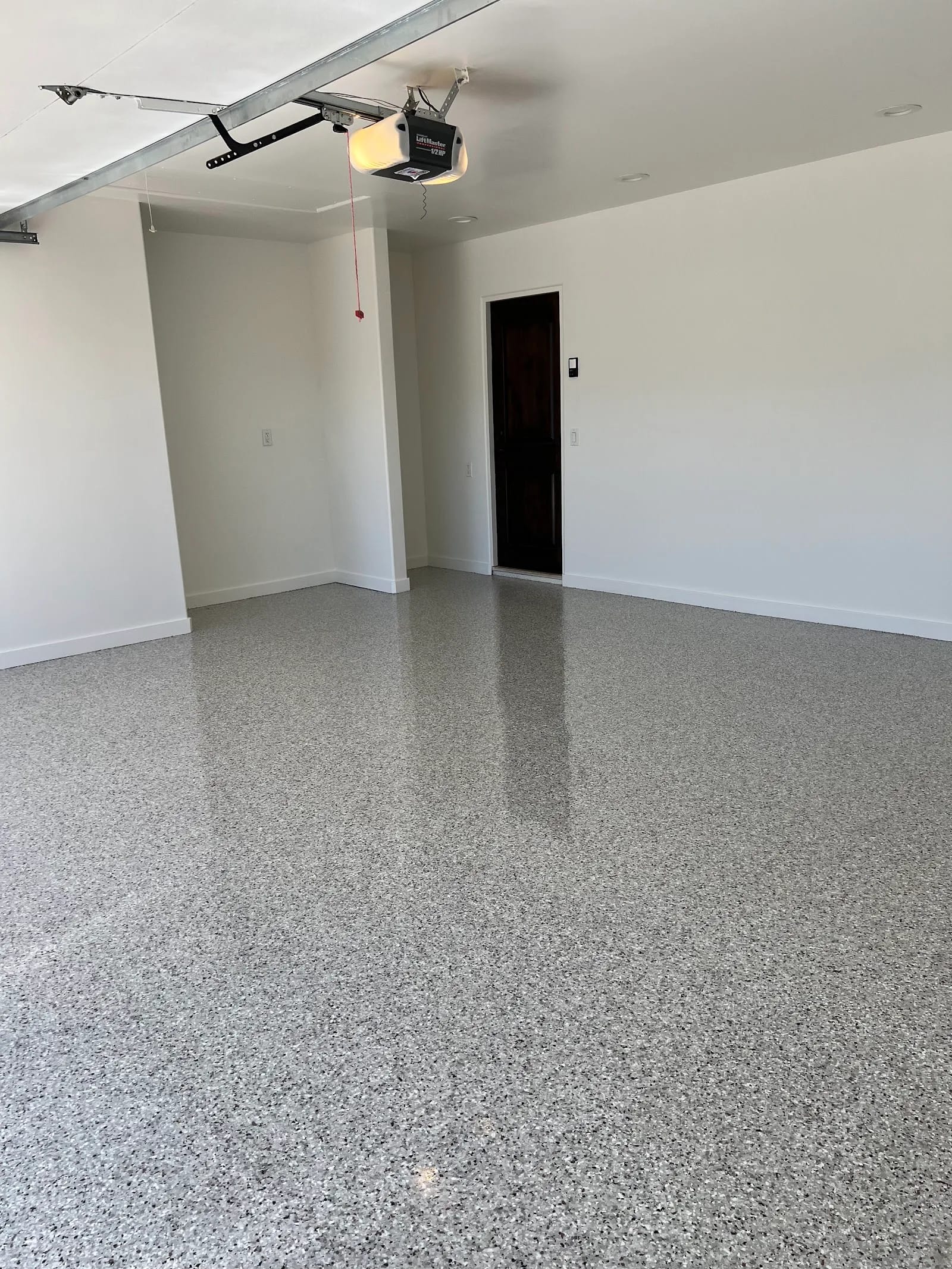 Freshly finished full-broadcast flake epoxy garage floor