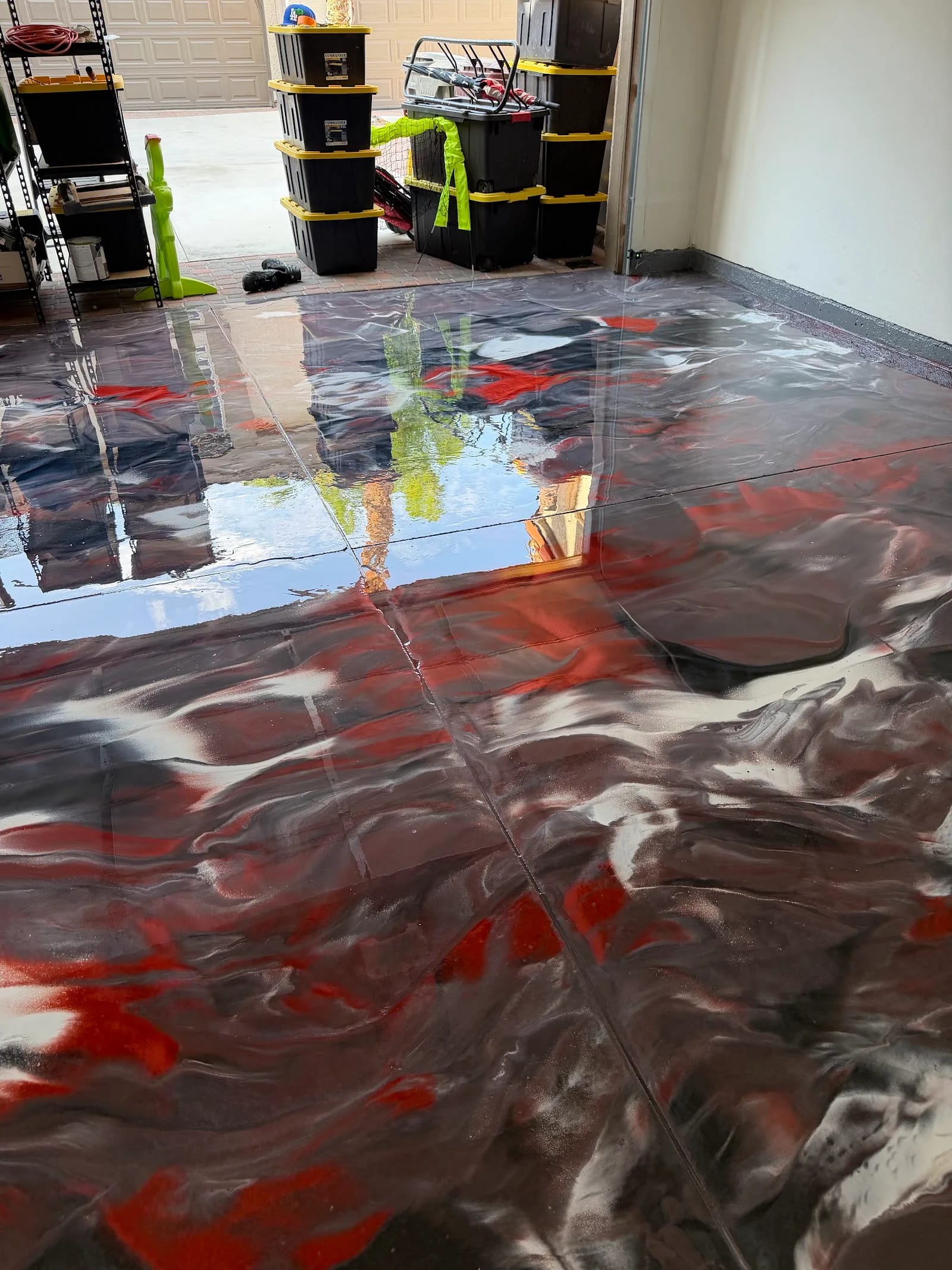 Red, black and white metallic epoxy floor by Brilliant Garage Floors