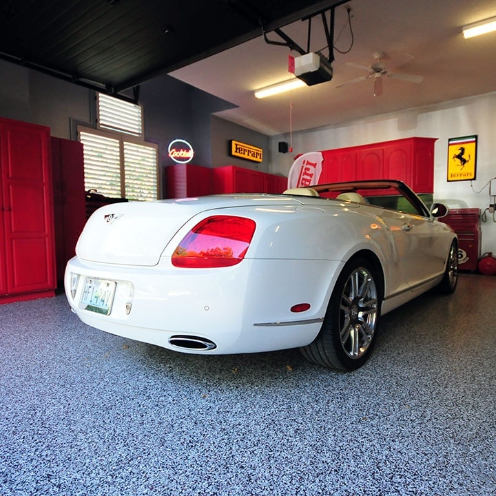 White Bentley convertible parked on a granite-flake epoxy garage floor in a Coachella Valley home